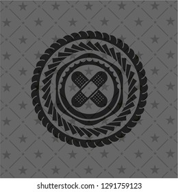 crossed bandage plaster icon inside realistic black emblem