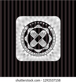 crossed bandage plaster icon inside silver shiny badge