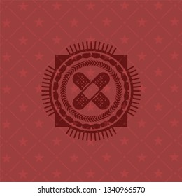 crossed bandage plaster icon inside vintage red emblem
