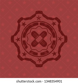 crossed bandage plaster icon inside badge with red background