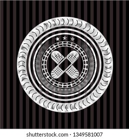 crossed bandage plaster icon inside silver badge or emblem