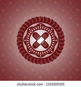 crossed bandage plaster icon inside red icon or emblem
