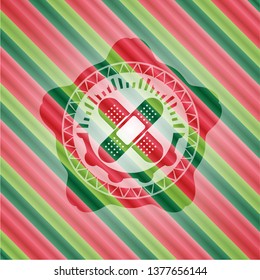 crossed bandage plaster icon inside christmas colors style emblem.
