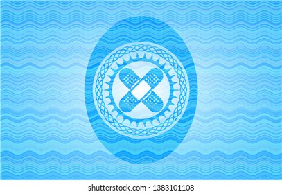 crossed bandage plaster icon inside sky blue water emblem background.