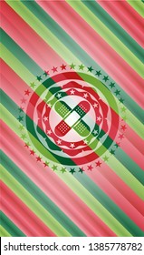 crossed bandage plaster icon inside christmas colors style emblem.
