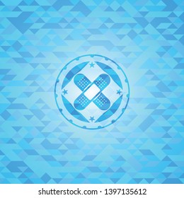 crossed bandage plaster icon inside sky blue emblem with mosaic background