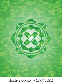 crossed bandage plaster icon inside green emblem. Mosaic background