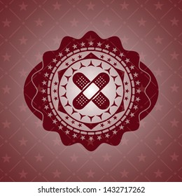 crossed bandage plaster icon inside red icon or emblem