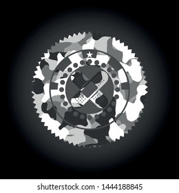crossed bandage plaster icon inside grey camouflage emblem