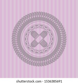 crossed bandage plaster icon inside pink emblem. Retro