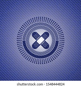 crossed bandage plaster icon inside emblem with denim high quality background