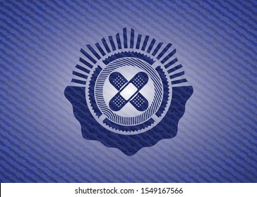 crossed bandage plaster icon inside emblem with denim high quality background