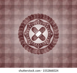 crossed bandage plaster icon inside red seamless geometric badge.