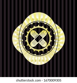 crossed bandage plaster icon inside gold badge