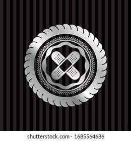 crossed bandage plaster icon inside silvery shiny badge