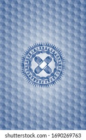 crossed bandage plaster icon inside blue badge with geometric pattern background.