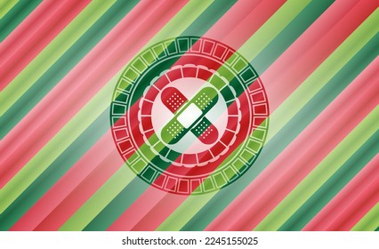 crossed bandage plaster icon inside christmas colors style emblem. 