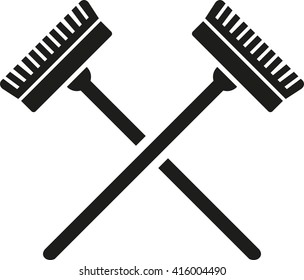 Crossed brooms