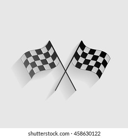 Crossed checkered flags logo waving in the wind conceptual of motor sport. Black paper with shadow on gray background.