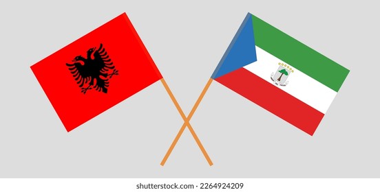 Crossed flags of Albania and Equatorial Guinea. Official colors. Correct proportion. Vector illustration
