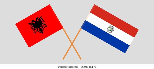 Crossed flags of Albania and Republic of Paraguay. Official colors. Correct proportion. Vector illustration.
