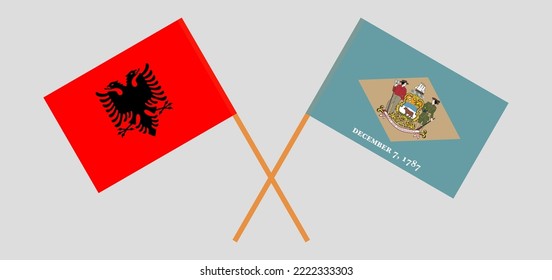 Crossed flags of Albania and The State of Delaware. Official colors. Correct proportion. Vector illustration
