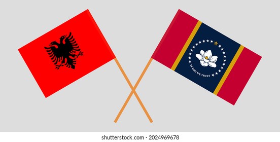 Banderas cruzadas de Albania y el Estado de Misisipi. Colores oficiales. Proporción correcta