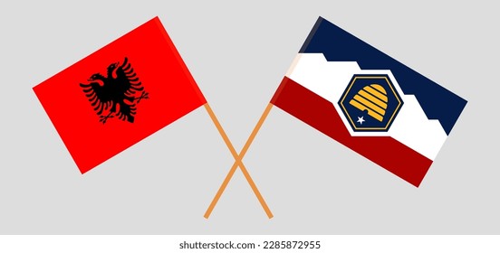 Crossed flags of Albania and The State of Utah. Official colors. Correct proportion. Vector illustration