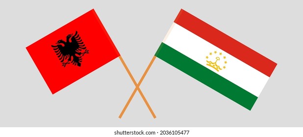 Crossed flags of Albania and Tajikistan. Official colors. Correct proportion