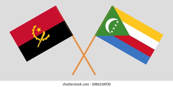 Crossed flags of Angola and the Comoros. Official colors. Correct proportion. Vector illustration
