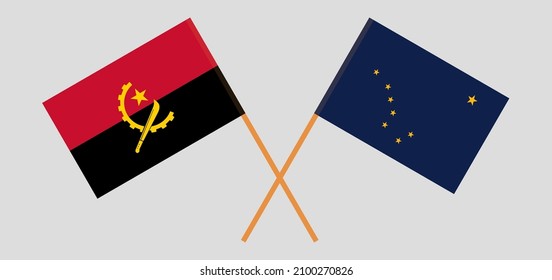 Crossed flags of Angola and the State of Alaska. Official colors. Correct proportion. Vector illustration
