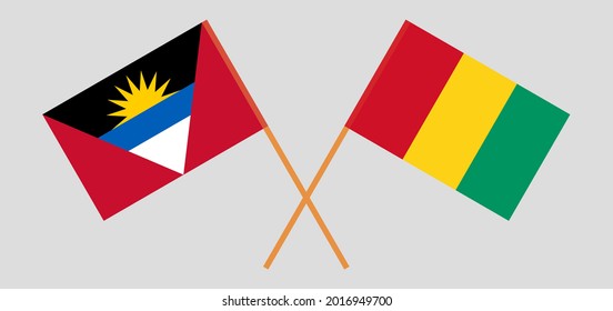 Crossed flags of Antigua and Barbuda and Guinea. Official colors. Correct proportion