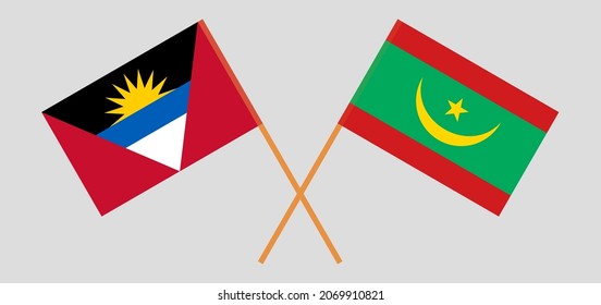 Crossed flags of Antigua and Barbuda and Mauritania. Official colors. Correct proportion