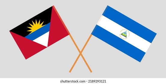 Crossed flags of Antigua and Barbuda and Nicaragua. Official colors. Correct proportion. Vector illustration
