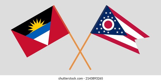 Crossed flags of Antigua and Barbuda and the State of Ohio. Official colors. Correct proportion. Vector illustration
