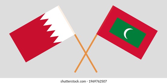 Crossed flags of Bahrain and Maldives. Official colors. Correct proportion