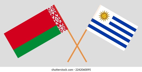 Crossed flags of Belarus and Uruguay. Official colors. Correct proportion. Vector illustration
