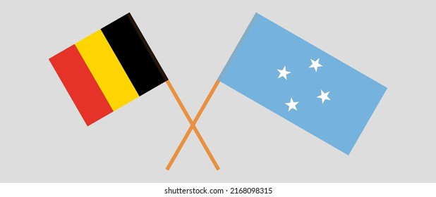 Crossed flags of Belgium and Micronesia. Official colors. Correct proportion. Vector illustration
