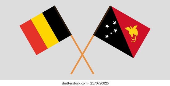 Crossed flags of Belgium and Papua New Guinea. Official colors. Correct proportion. Vector illustration
