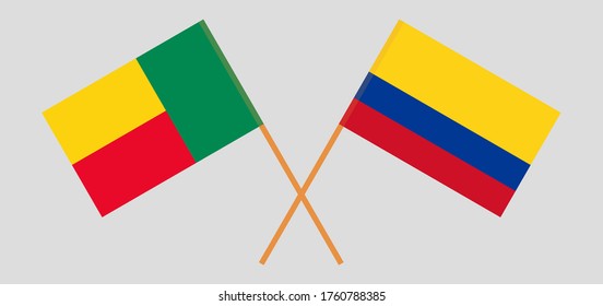 Crossed flags of Benin and Colombia. Official colors. Correct proportion. Vector illustration
