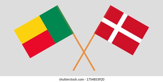 Crossed flags of Benin and Denmark. Official colors. Correct proportion. Vector illustration
