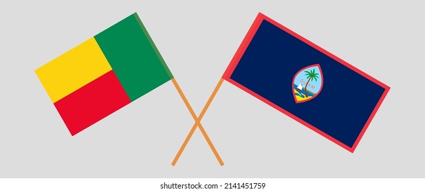 Crossed flags of Benin and Guam. Official colors. Correct proportion. Vector illustration
