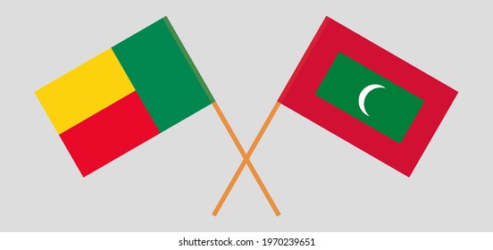 Crossed flags of Benin and Maldives. Official colors. Correct proportion