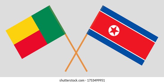 Crossed flags of Benin and North Korea. Official colors. Correct proportion. Vector illustration
