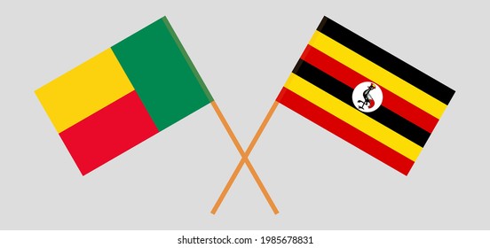 Gekreuzte Flaggen von Benin und Uganda. Offizielle Farben. Richtiger Anteil