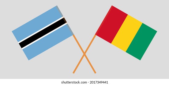 Crossed flags of Botswana and Guinea. Official colors. Correct proportion