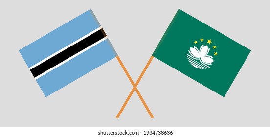 Crossed flags of Botswana and Macau. Official colors. Correct proportion