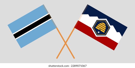 Crossed flags of Botswana and The State of Utah. Official colors. Correct proportion. Vector illustration
