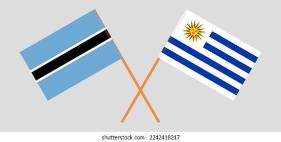Banderas cruzadas de Botswana y Uruguay. Colores oficiales. Proporción correcta. Ilustración del vector
