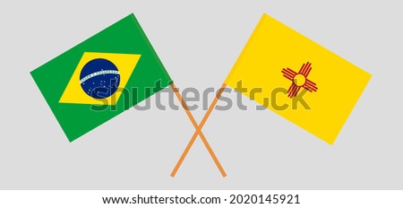 Crossed flags of Brazil and the State of New Mexico. Official colors. Correct proportion